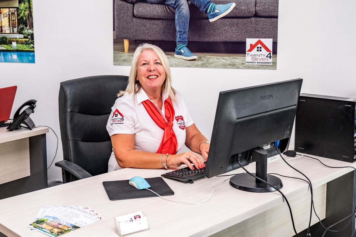 Jen at her desk in the Twenty4Seven property management office